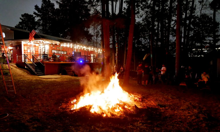 Karaoke night at Epic Creative Co-Op - Participants enthusiastically singing into microphones during a fun karaoke night, with colorful lights and cheering friends.